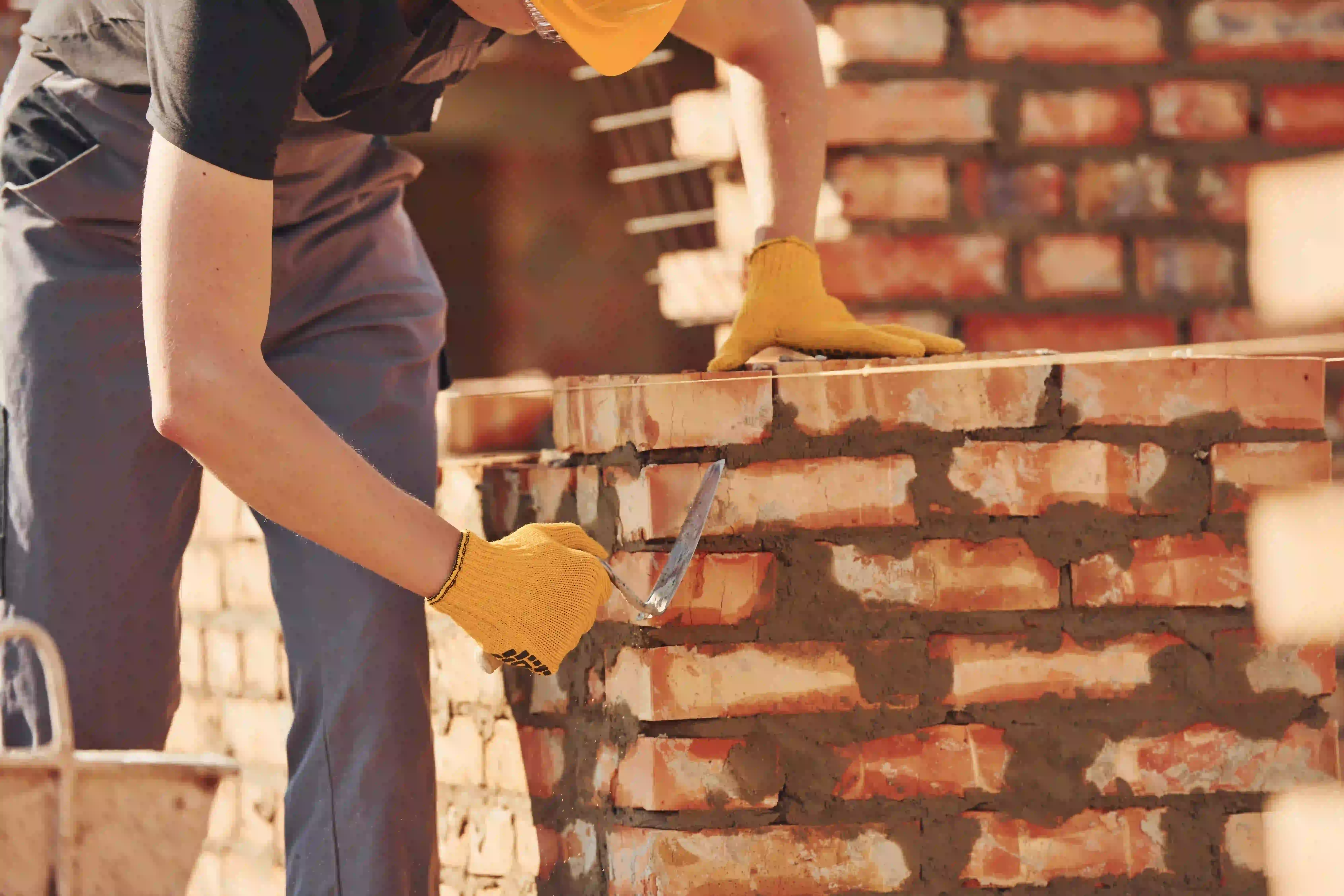 Licensed Masonry Contractor constructing a brick wall in New Jersey